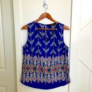 Split-neck printed sleeveless top. Size medium.